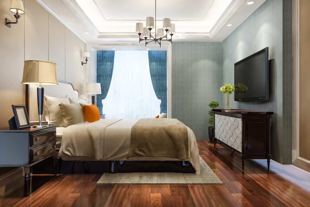 3D rendering of a luxury hotel bedroom highlighting elegant bedroom furniture settings with a plush bed, chandelier lighting, TV unit, and coordinated side tables.