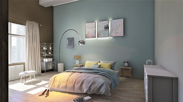 Stylish bedroom with a modern bed, soft bedding, and warm ambient lighting