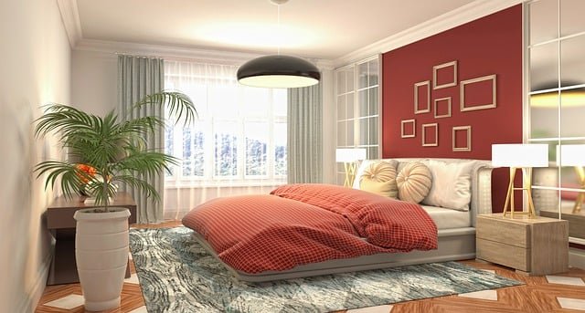 Modern bedroom decor with a comfortable bed, soft neutral bedding, minimal furniture, and warm lighting creating a cozy and inviting space