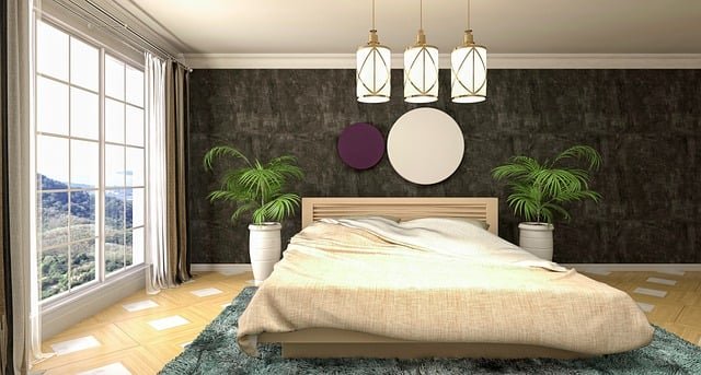 Modern bedroom decor with a neatly made bed, soft neutral bedding, minimal furniture, and warm lighting for a cozy and relaxing atmosphere