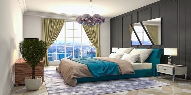 Elegant bedroom decor with a neatly styled bed, soft bedding, modern accents, and warm lighting creating a calm and cozy atmosphere
