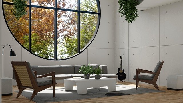 A modern living room design for a small house featuring simple furniture and biophilic decor.