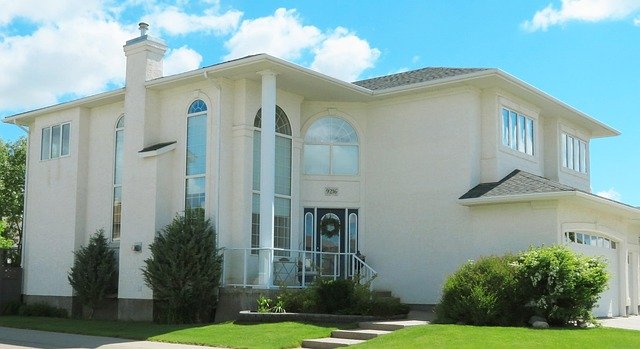 Beautiful house exterior with a well-designed front yard, showcasing balanced landscaping and strong curb appeal