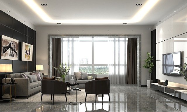 Modern living room with a wall-mounted TV, sleek furniture, and minimalist decor.