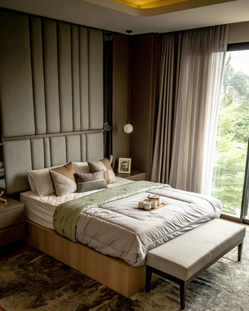 Bedroom decor ideas featuring a modern cozy bedroom with layered bedding, warm ambient lighting, and simple decorative accents