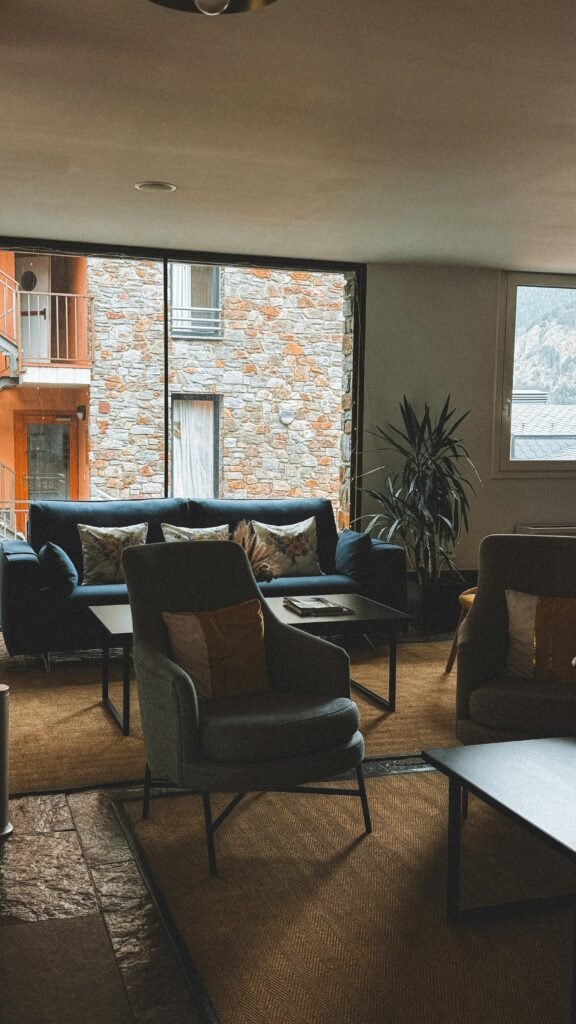 Cozy living room ideas featuring a warm seating area with soft lighting, layered textiles, and natural decor for a comfortable, inviting atmosphere.