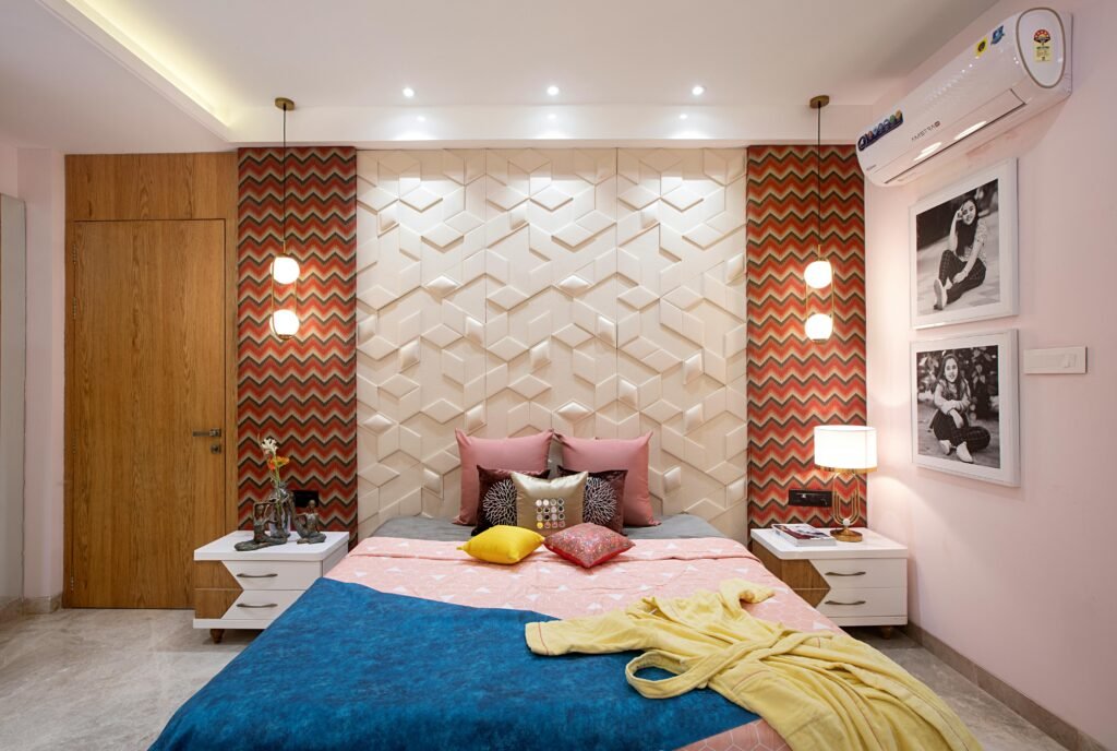 Bedroom decor ideas showcasing a modern, well-styled bedroom with layered bedding, warm lighting, and clean design details