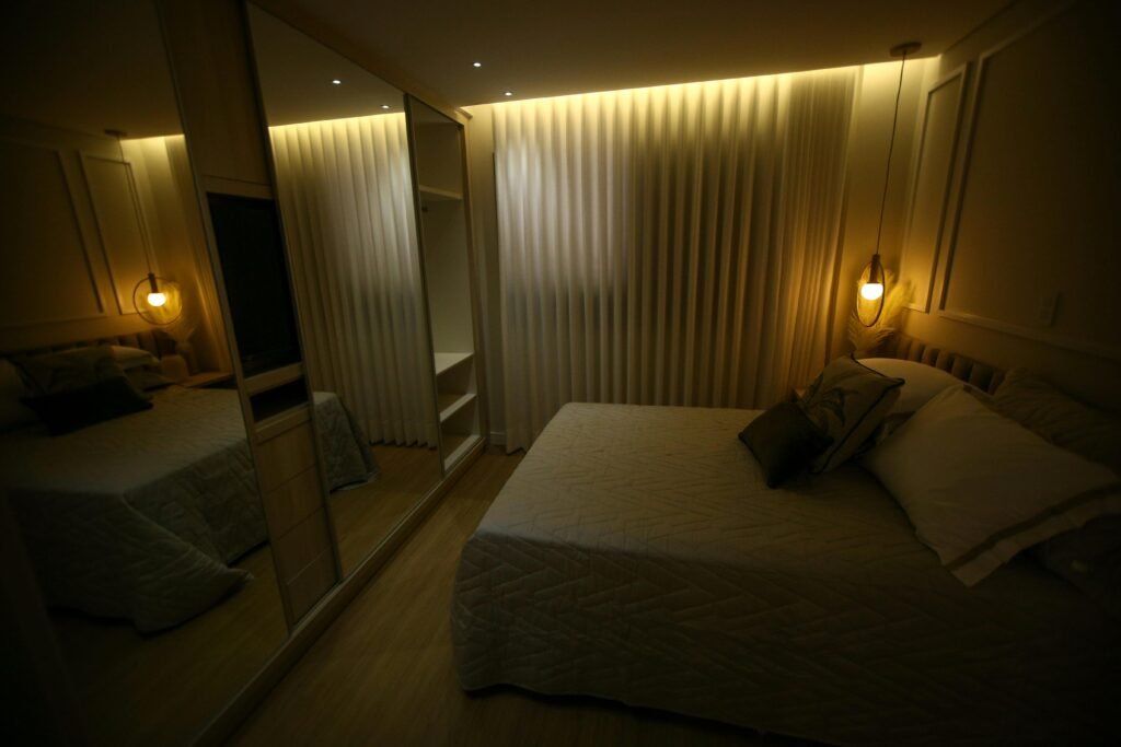 Cozy bedroom interior with modern bed, bedside tables, and decorative accents