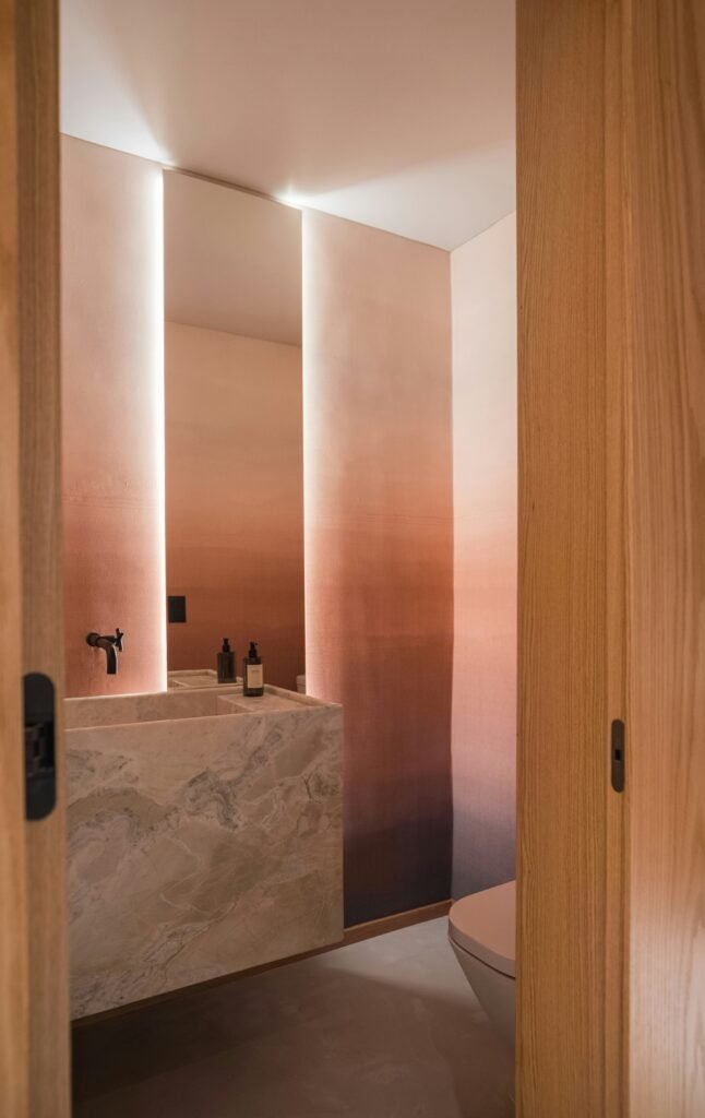 Stylish bathroom decorations with patterned tiles, modern sink vanity, decorative mirror, and coordinated accessories for a vibrant look.