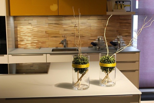 Small kitchen decor ideas featuring a compact kitchen with modern cabinets, efficient storage, and a space-saving layout.