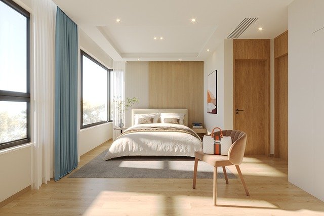 Modern master bedroom with minimalist decor, soft lighting, and neutral tones creating a cozy retreat.