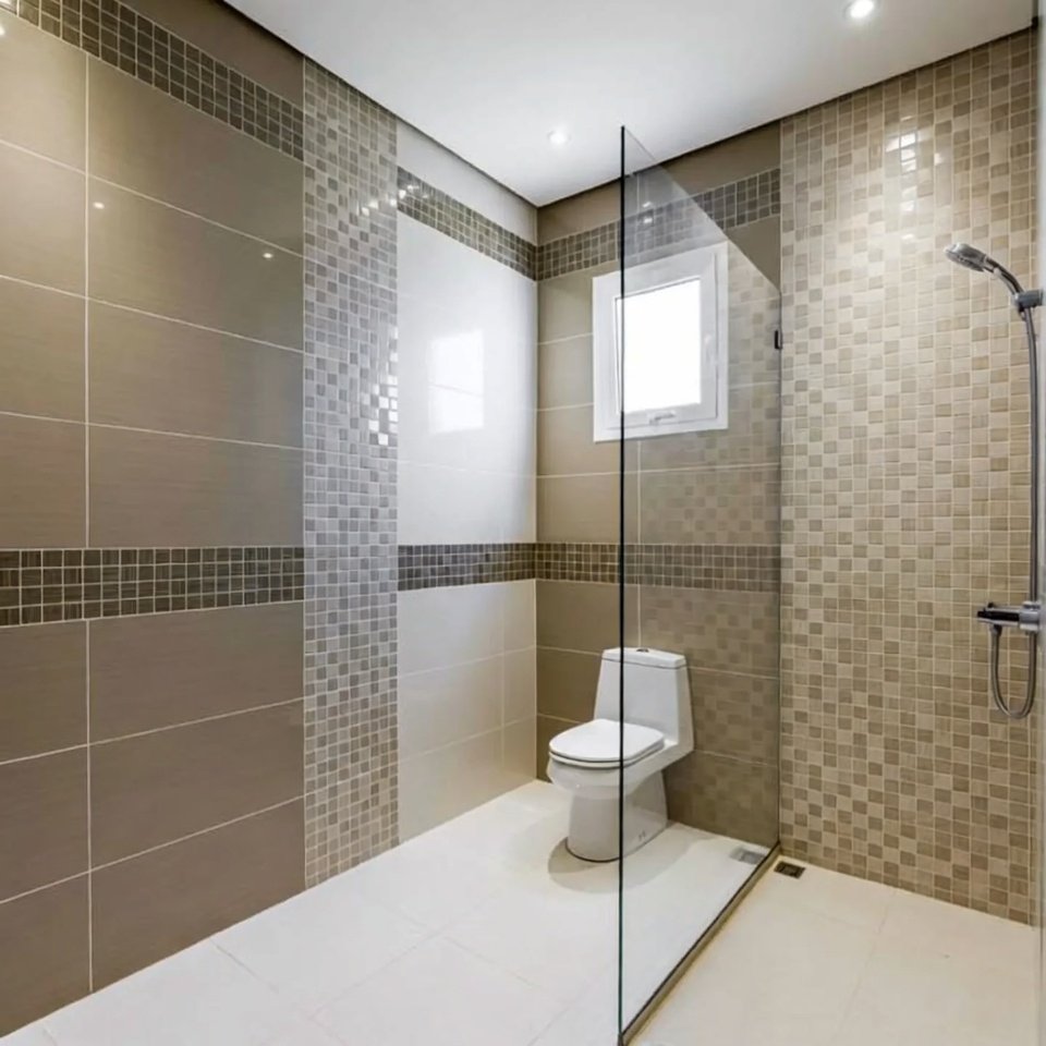 Bathroom interior with mixed wall and floor tiles combining different textures and patterns