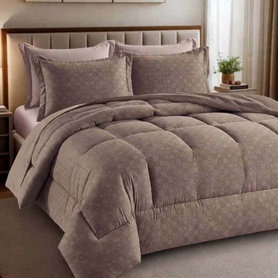 Bedroom with a trending comforter and sheets featuring layered bedding, soft textures, and a coordinated color palette.