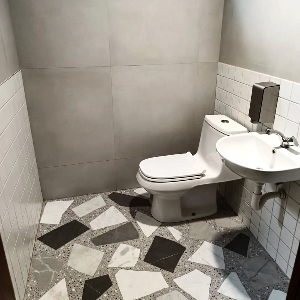 : contemporary bathroom floor with geometric patterned tiles showcasing unique bathroom tile ideas floor designs