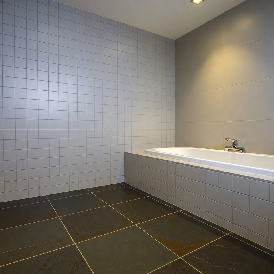 small bathroom floor with white hexagon tiles showcasing stylish bathroom tile ideas floor designs