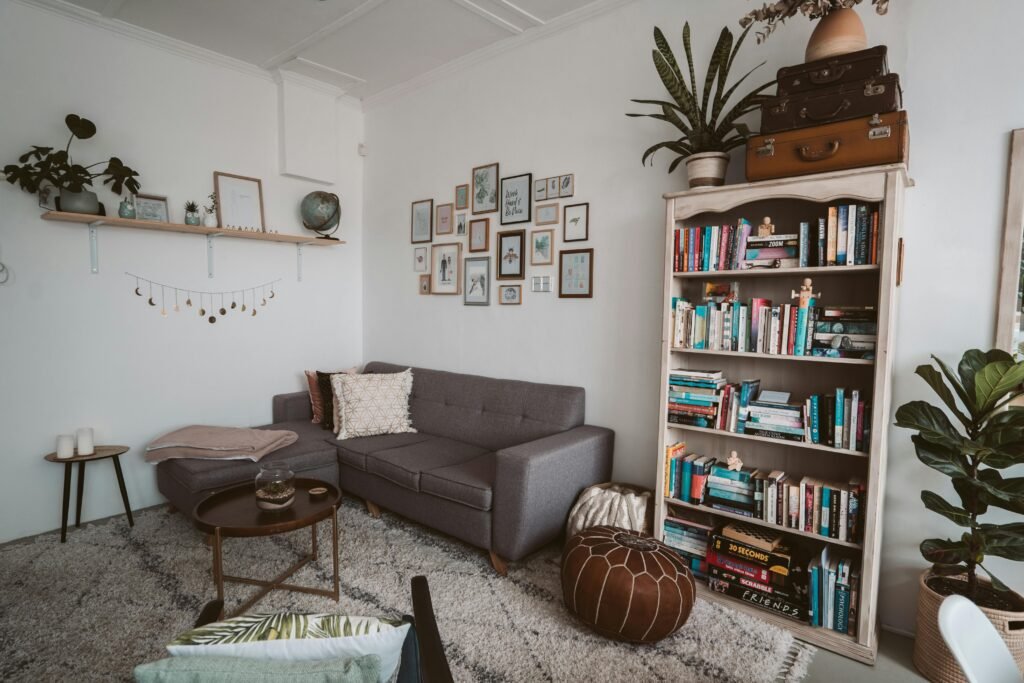 Living room with cozy reading corner and tall indoor plants