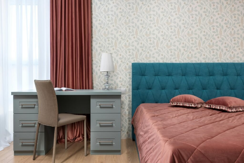 Luxury bedroom vanity with marble countertop, mirror, and modern storage drawers