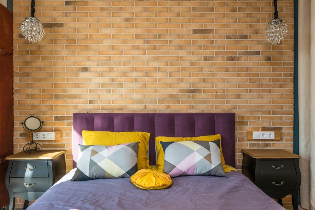 Contemporary bedroom with large wall art for bedroom above the bed, upholstered headboard and soft lighting