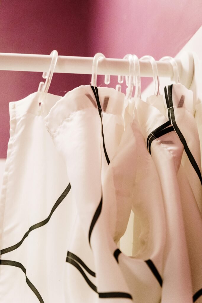 Cozy bathroom with soft shower curtain, warm lighting, and simple modern setup