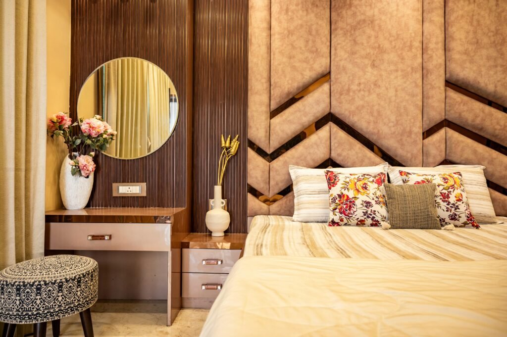 Modern bedroom vanity setup with mirror, storage drawers, and elegant lighting in a clean interior