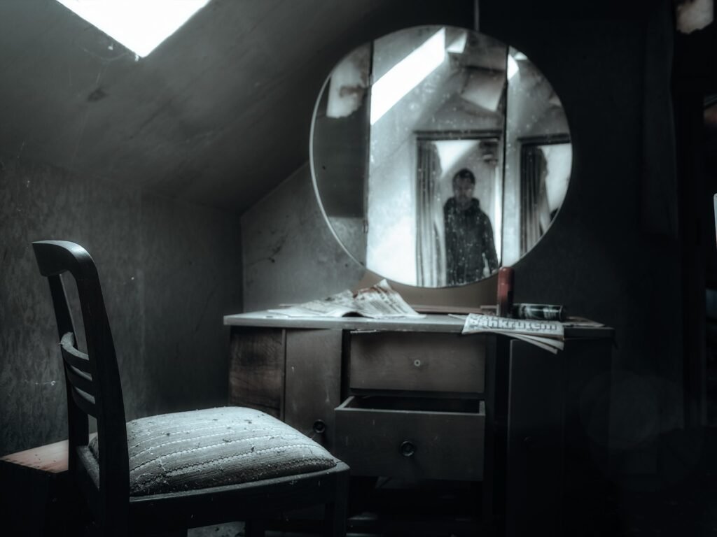 Classic wooden vanity with mirror, drawers, and vintage bedroom interior