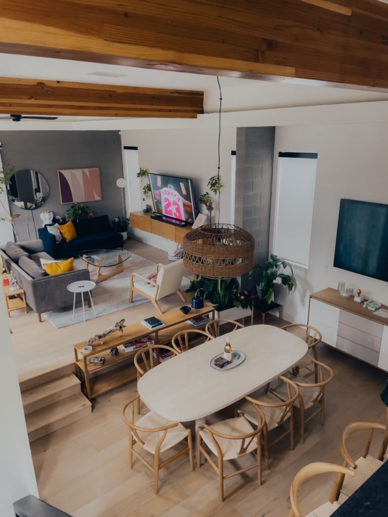 Elegant modern dining room featuring luxury details, a designer dining table, upholstered chairs, statement chandelier, premium finishes, and refined decor inspired by modern dining room ideas.