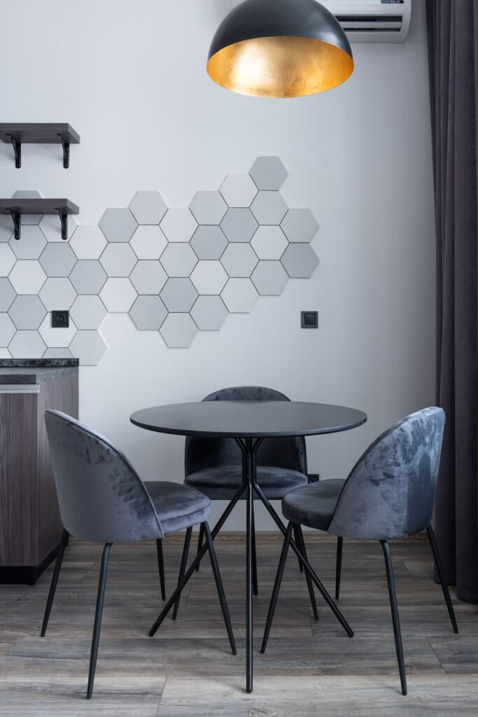 Luxury dining room with warm neutral colors, a modern dining table, upholstered chairs, and elegant lighting inspired by modern dining room ideas.