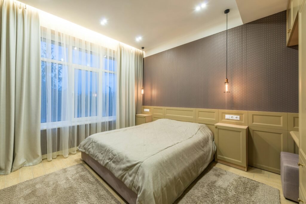 Affordable house in the USA featuring bedroom decorating ideas with updated electrical work, modern lighting fixtures, and safe, budget-friendly wiring improvements.