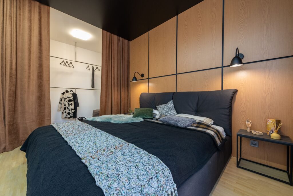 Modern master bedroom with organic modern design, featuring natural textures, soft neutral tones, wooden elements, and a calm contemporary layout.