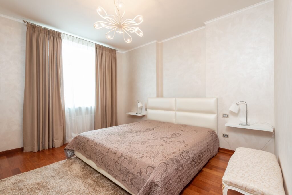 Master bedroom design ideas featuring large windows, abundant natural light, neutral decor, and a bright, airy bedroom layout.