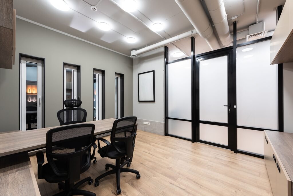 Office coffered ceiling design with recessed ceiling panels, decorative beams, and modern lighting that creates a professional and elegant workspace.