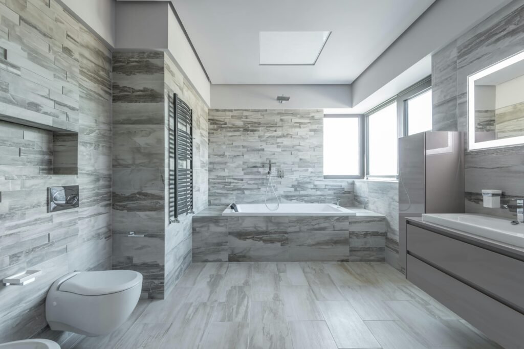 Modern bathroom ideas showcased in a bright white bathroom with a sleek vanity, frameless glass shower, freestanding bathtub, and clean contemporary design.