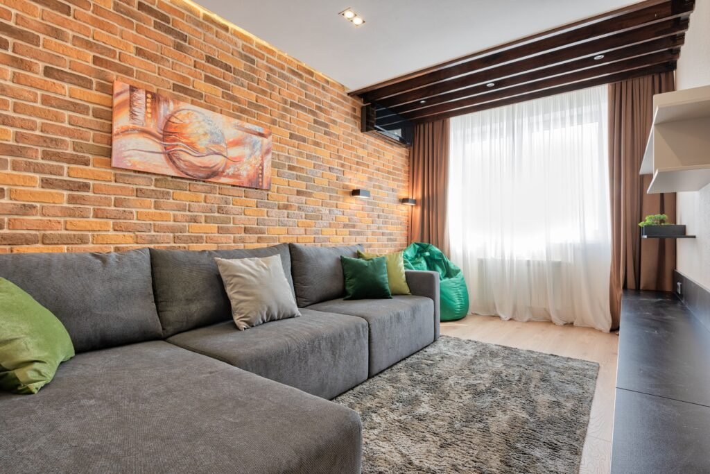 warm and cozy Living room with earthy color accents featuring warm brown, terracotta, and olive green decor elements
