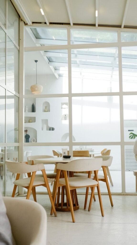 Luxury minimalist dining room with clean-lined furniture, simple decor, and a neutral palette inspired by modern dining room ideas.