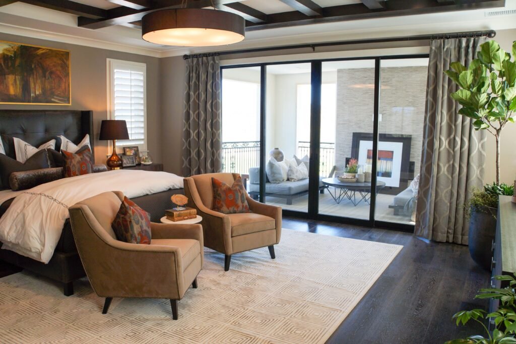 Modern master bedroom with smart bedroom systems, featuring automated lighting, smart controls, sleek furniture, and a contemporary connected interior design.
