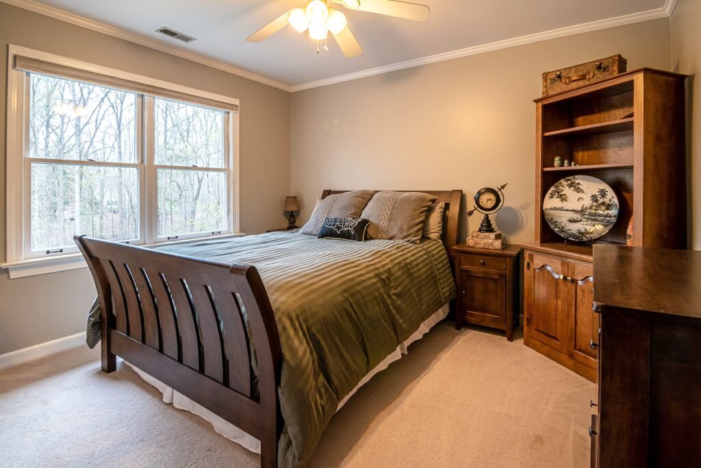 Affordable house in the USA showcasing bedroom decorating ideas with balanced furniture placement, proper lighting, and a clutter-free layout.