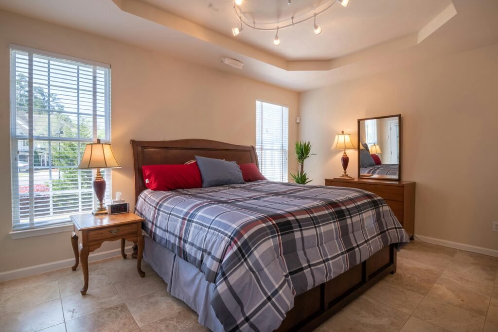 Bedroom Decorating Ideas for an Affordable House in USA with Warm Wood and Earthy Tones