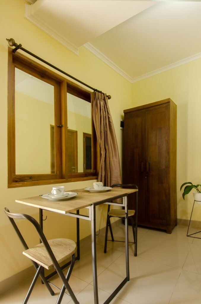 : Small apartment dining room featuring modern furniture, a compact dining table, smart space-saving solutions, stylish decor, and functional design inspired by modern dining room ideas.