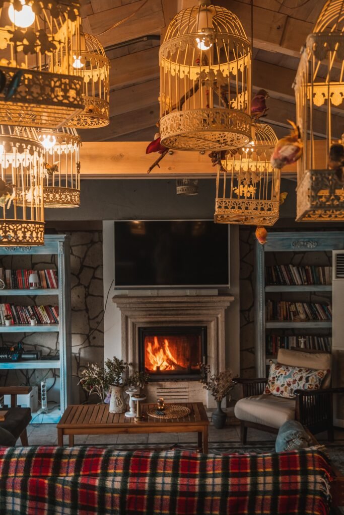 warm and cozy Living room showcasing layered lighting ideas with ambient, task, and accent lights creating a warm and balanced atmosphere