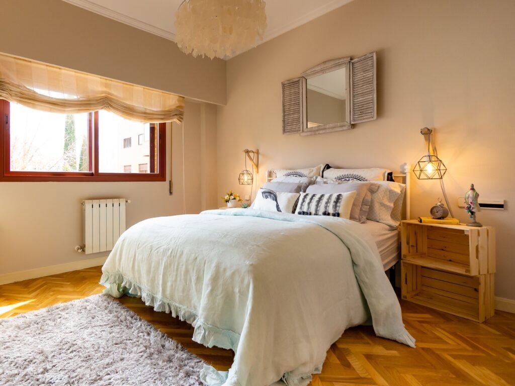Affordable bedroom filled with natural light, featuring a budget-friendly bed, matching furniture, and airy decor from the most affordable bedroom furniture sets 2026.