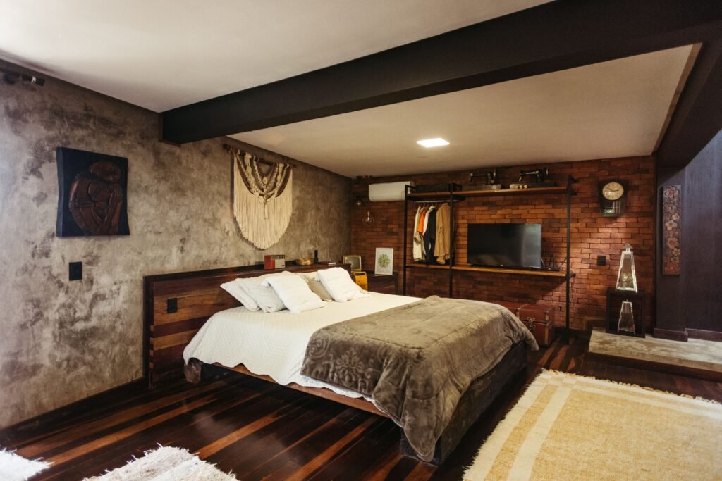 Modern master bedroom with natural wood integration, featuring wooden furniture, warm textures, neutral décor, and a stylish contemporary design.
