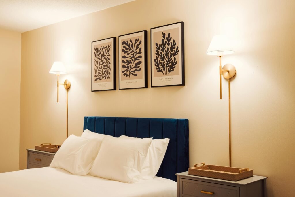 Master bedroom design ideas featuring decorative wall sconces, a stylish bed, warm lighting, and a sophisticated bedroom interior.