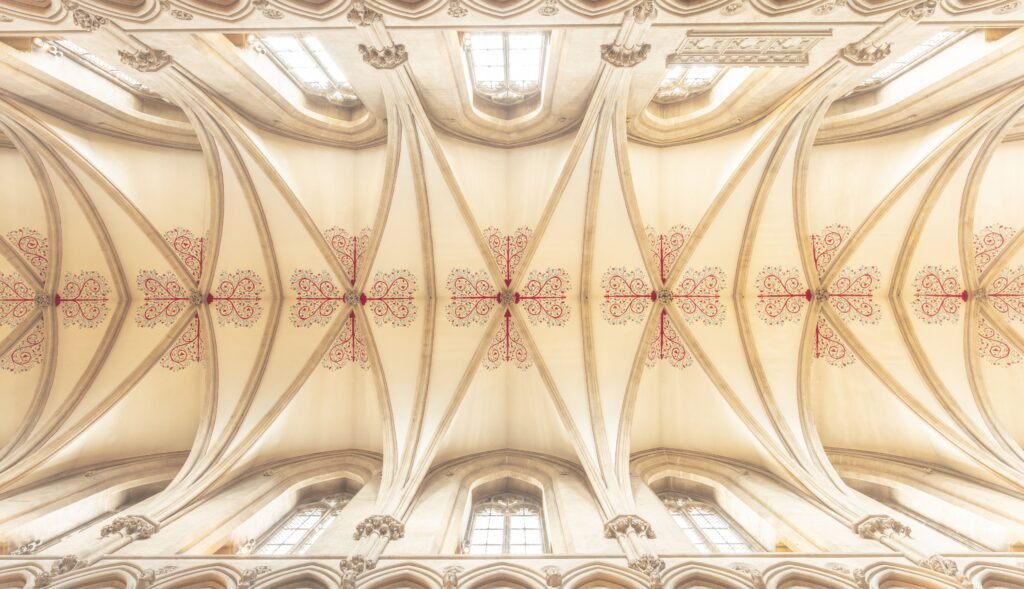 Cathedral coffered ceiling design with vaulted beams, recessed panels, and elegant architectural details that create a grand interior.