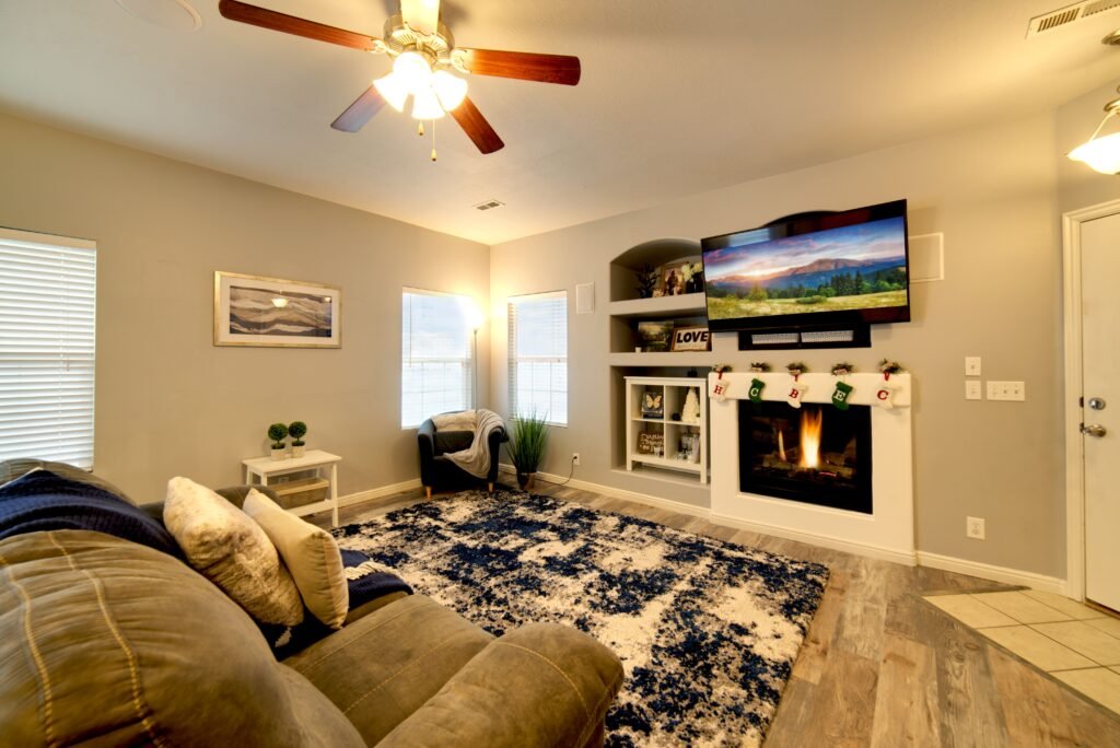 Minimalist warm and cozy living room with limited furniture, clean lines, and a warm, uncluttered atmosphere