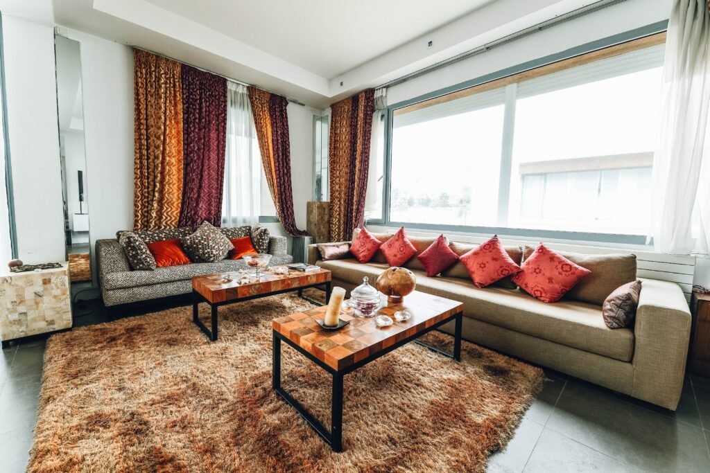 warm and cozy Living room with furniture arranged away from the walls to create a cozy conversation area and balanced layout