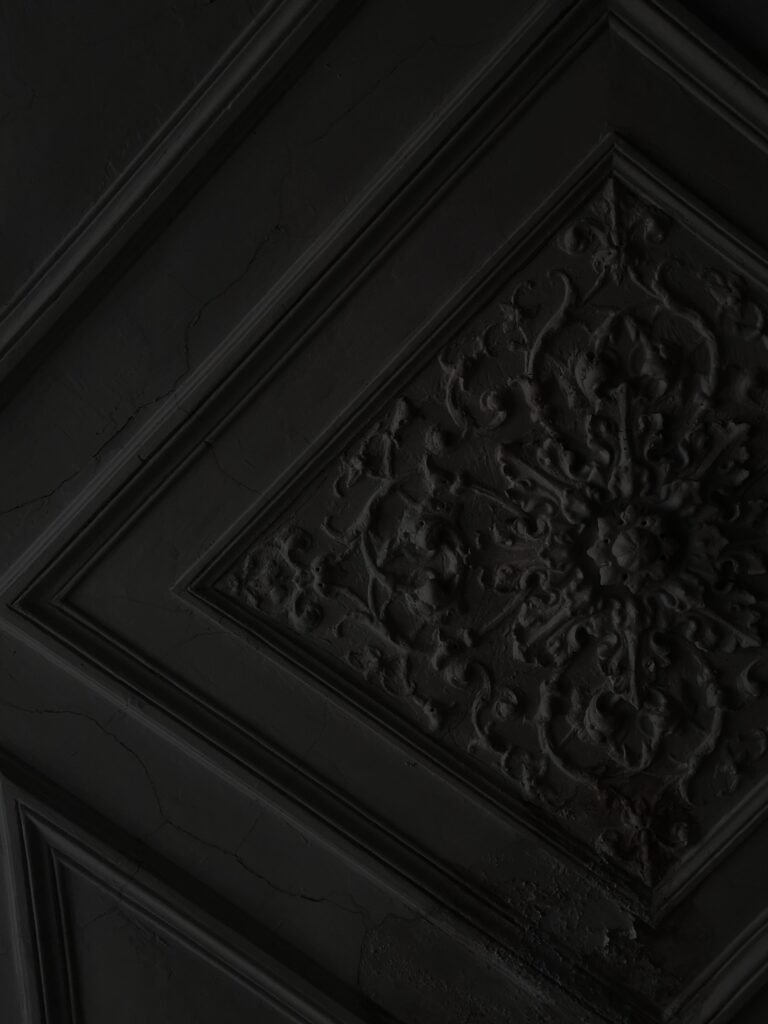 Dark coffered ceiling ideas with deep-toned beams, recessed panels, and elegant lighting that create a bold and sophisticated interior.