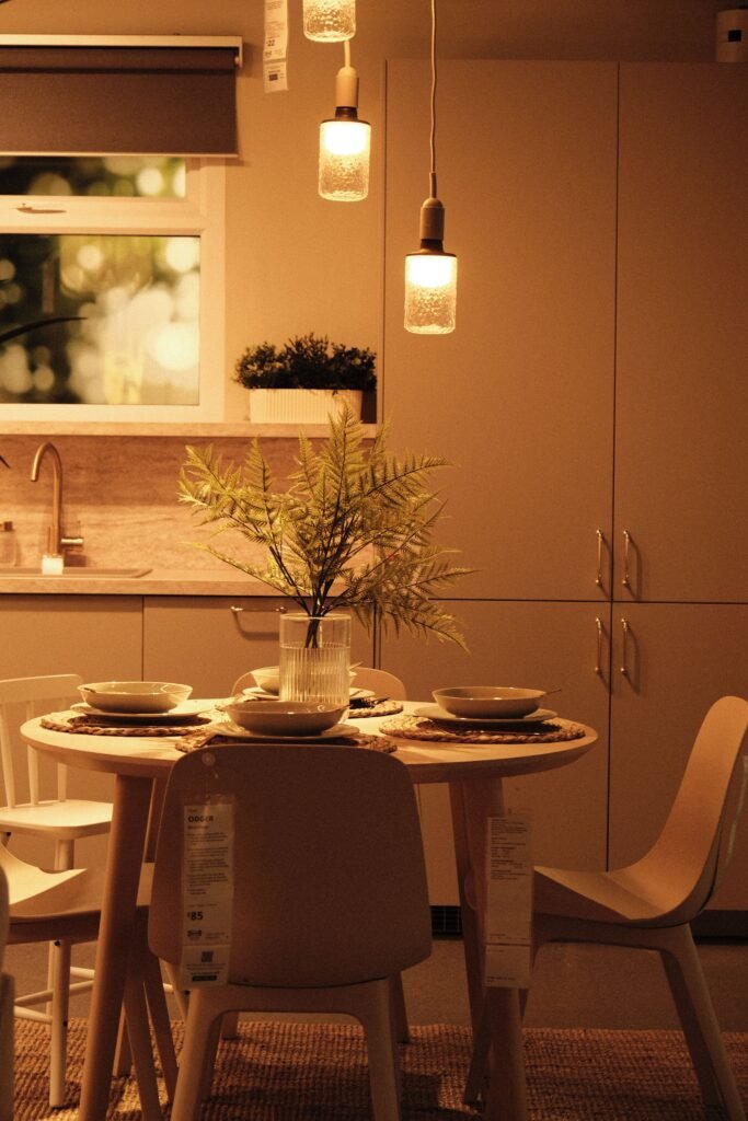 Luxury dining room with a statement light fixture above the dining table, elegant seating, and sophisticated decor inspired by modern dining room ideas.