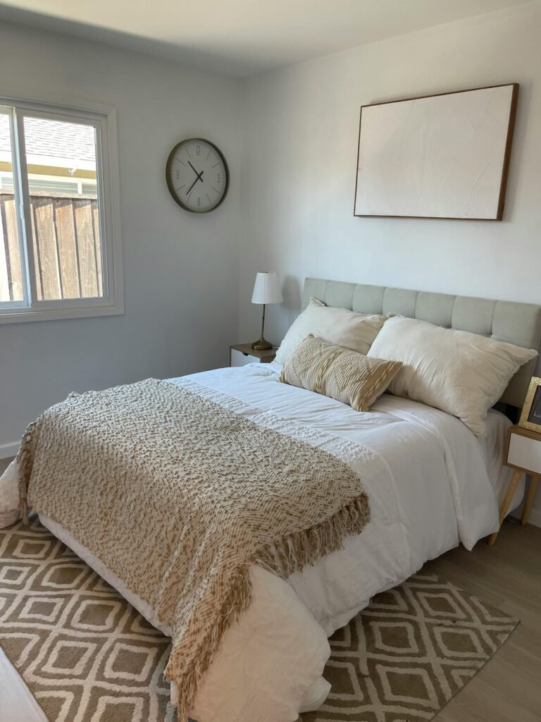Affordable house in the USA featuring light paint colors and elegant bedroom decorating ideas with bright, airy, and budget-friendly design elements.