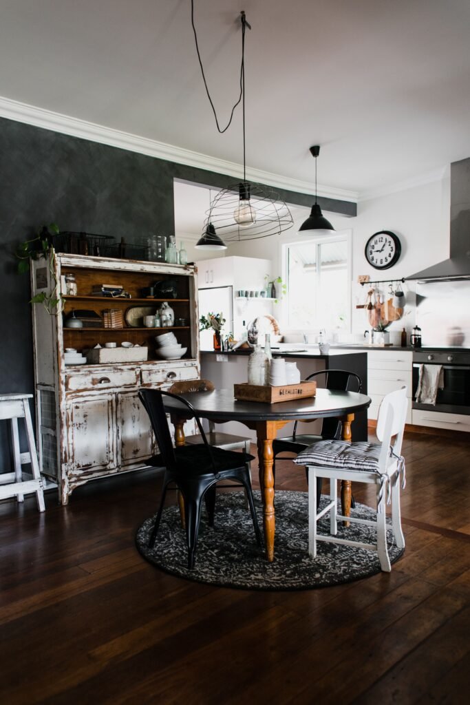 Modern farmhouse dining room with wooden table, mixed materials, and rustic decor inspired by modern dining room ideas.